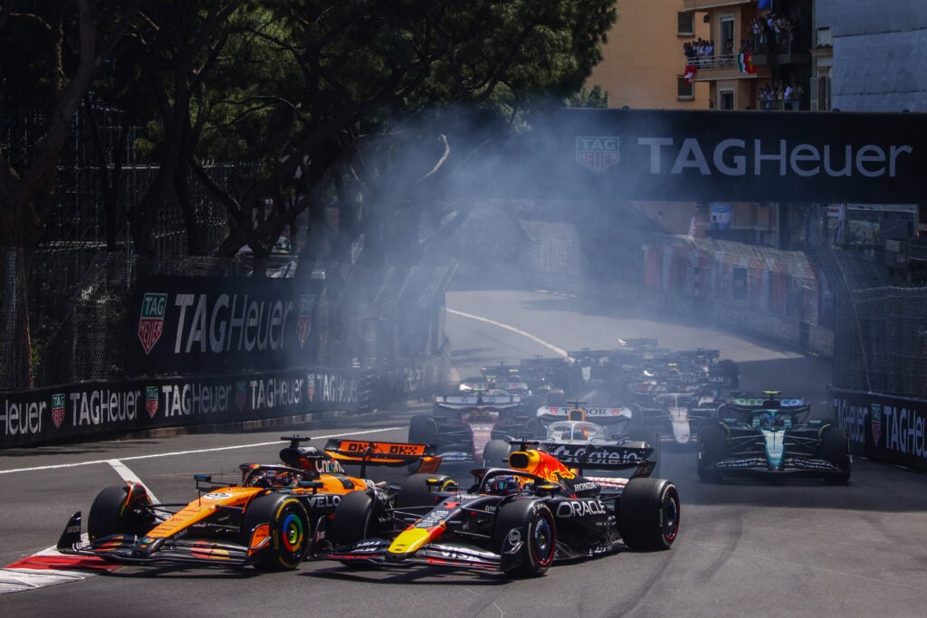 gettyimages-2216688064-1024x683-1 McLaren driver Lando Norris defends from Max Verstappen of Red Bull at the start of the 2025 F1 Monaco Grand Prix