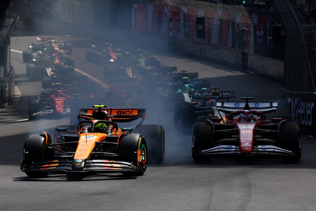 gettyimages-2216963508-1024x683-1 McLaren driver Lando Norris locks up into the first corner ahead of Ferrari driver Charles Leclerc at the start of the 2025 Monaco Grand Prix