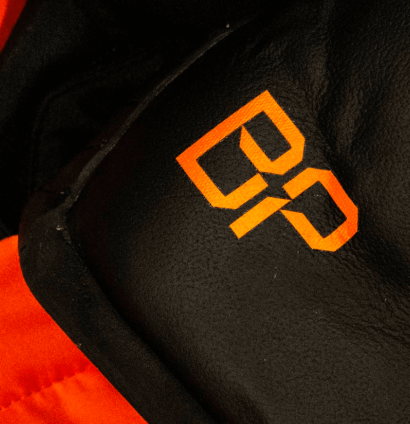 brad-pitt-mclaren-test-race-suit-overalls-f1-movie-2025-410x424-1 A set of McLaren F1 overalls featuring Brad Pitt's initials