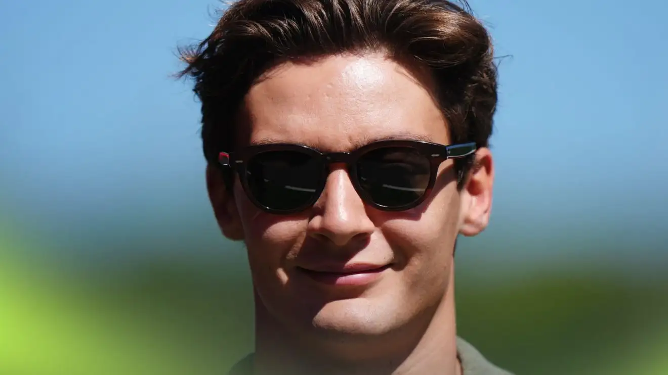 c-111 Mercedes driver George Russell enters the paddock at the 2025 Spanish Grand Prix