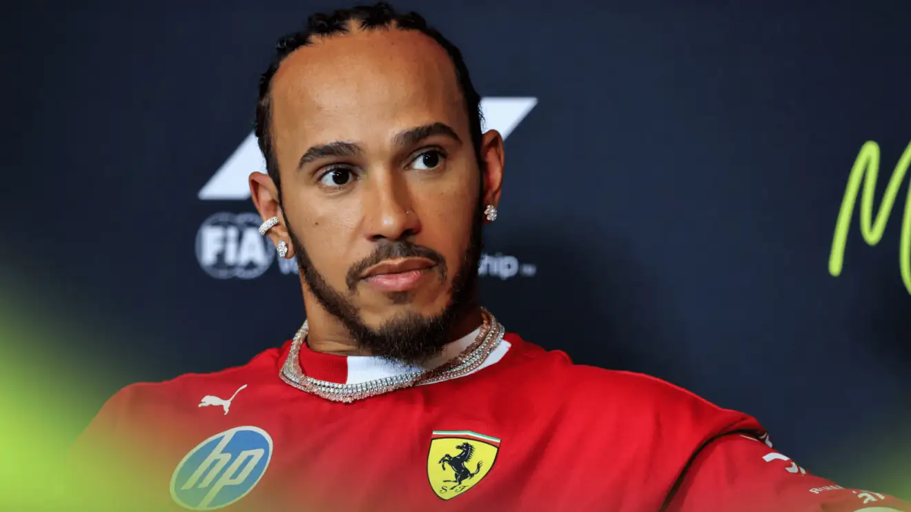 c-1114 Lewis Hamilton looks on in a press conference