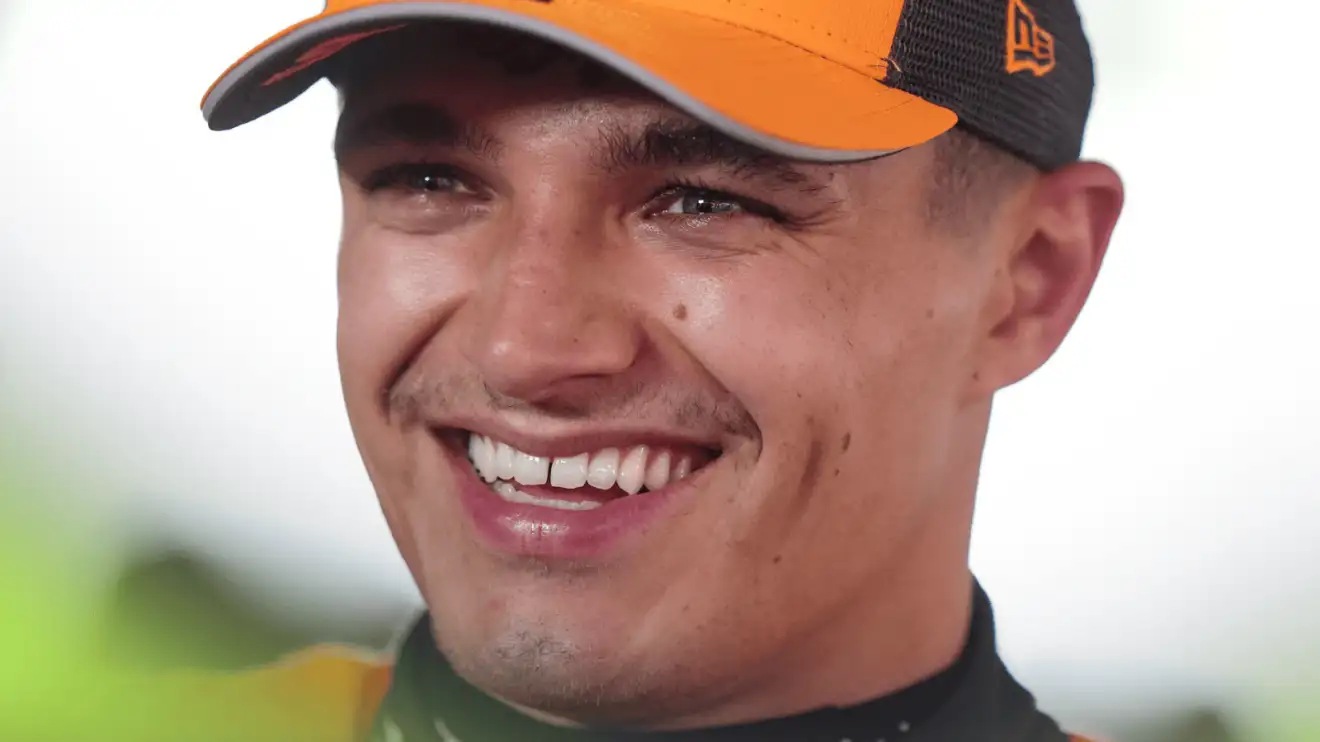 c-144 A close-up shot of Lando Norris smiling broadly