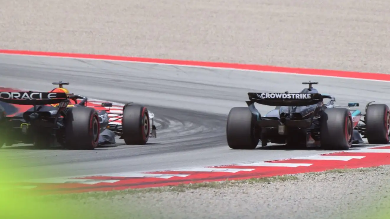 c-204 Max Verstappen (Red Bull, left), running alongside George Russell (Mercedes, right) at the 2025 Spanish Grand Prix