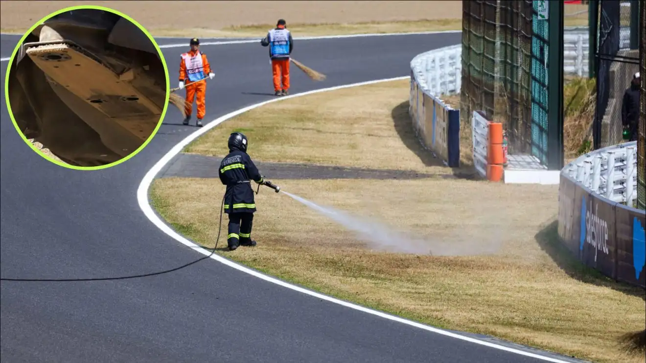 c-210 Grass being watered at the Japanese Grand Prix to put out fires