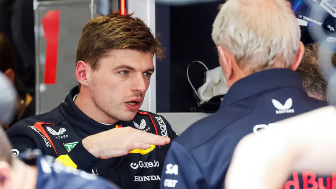 Max Verstappen explaining to Helmut Marko