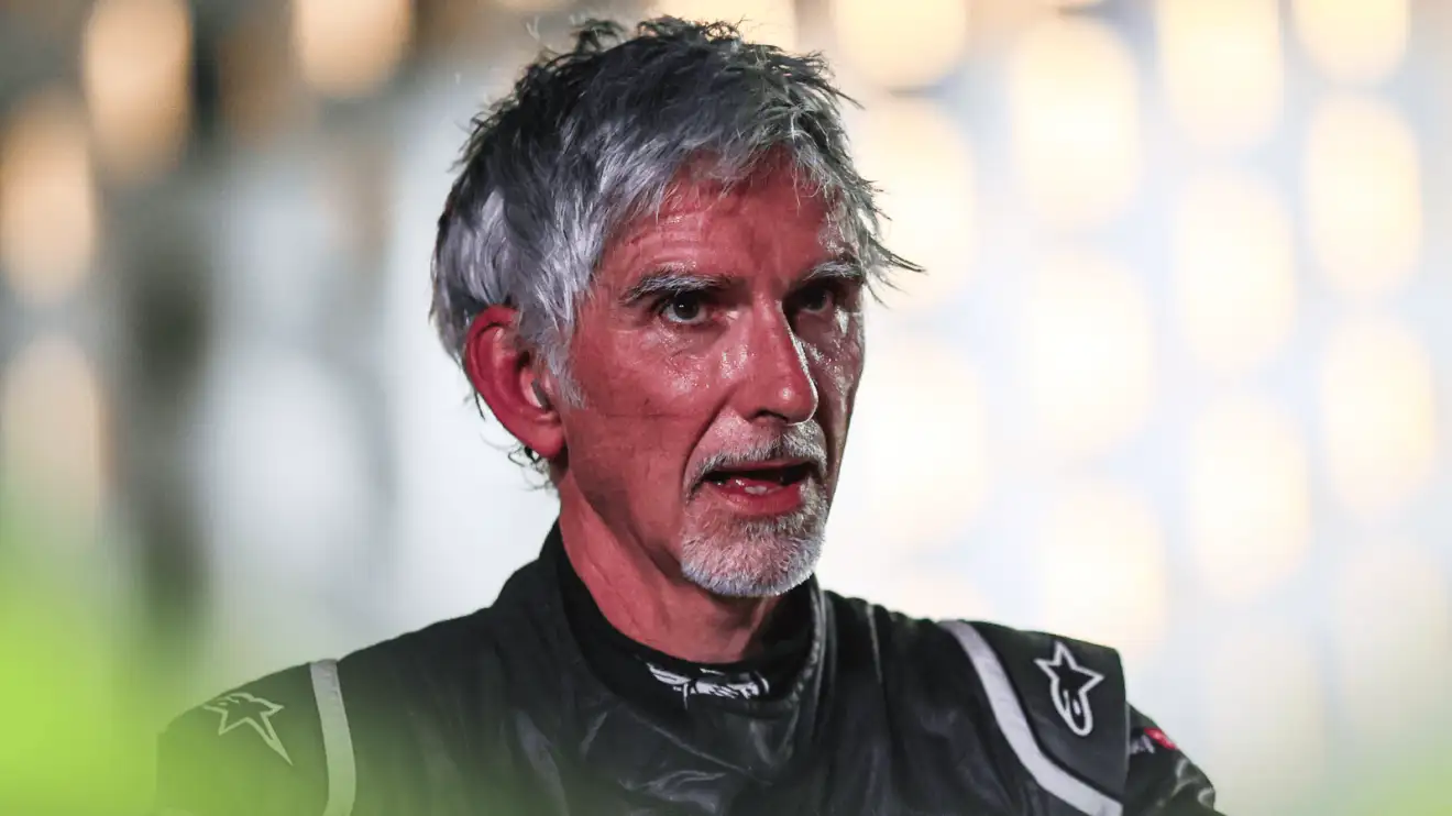 c-326 Damon Hill looks exhausted while wearing racing overalls