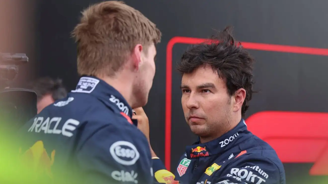 c-381 Sergio Perez looks directly at Max Verstappen in parc ferme at Zandvoort