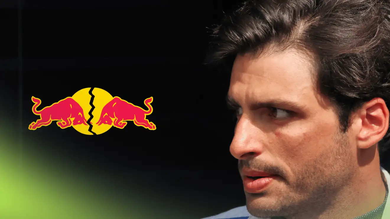 c-384 A side-profile shot of Carlos Sainz with a cracked Red Bull logo alongside him