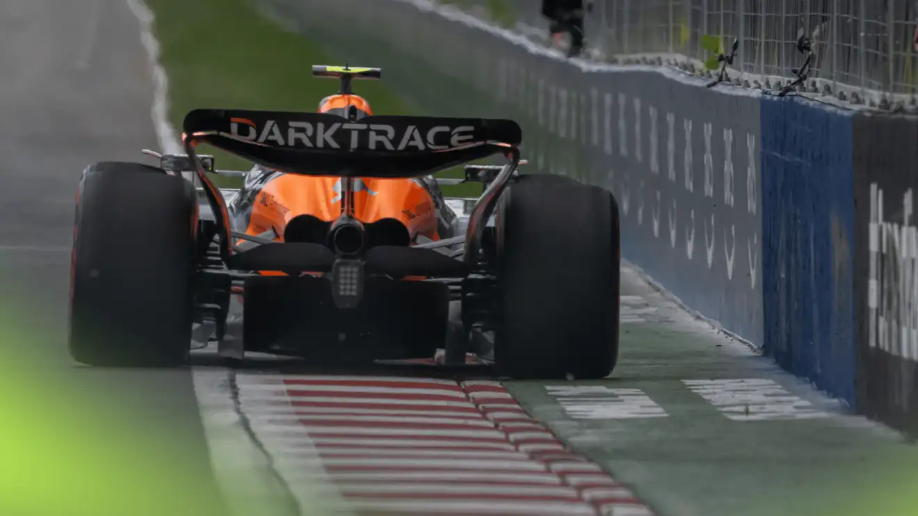 c-396 A rear-facing shot of Lando Norris's McLaren exiting the final corner in Canada