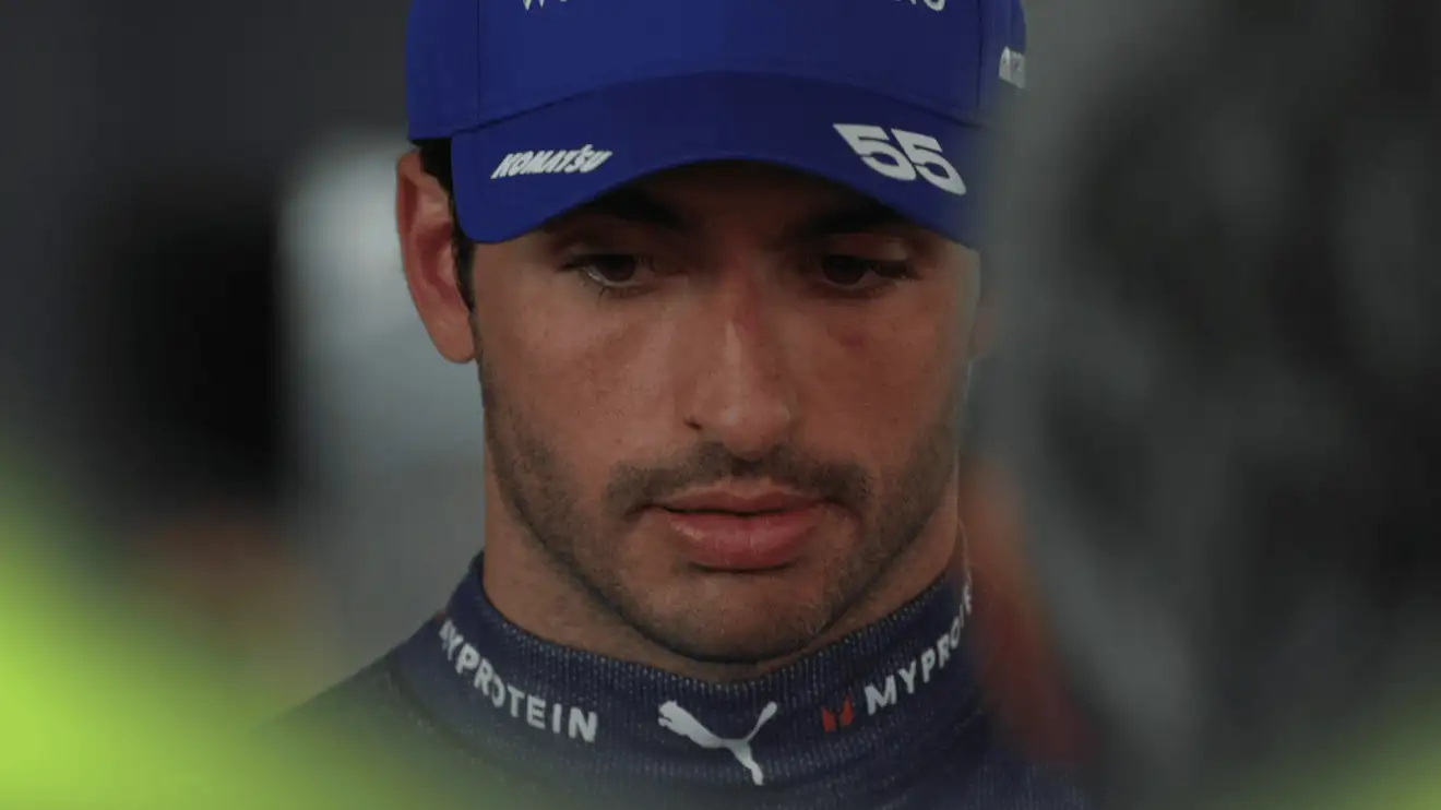 c-435 Carlos Sainz looks downbeat as he faces the media