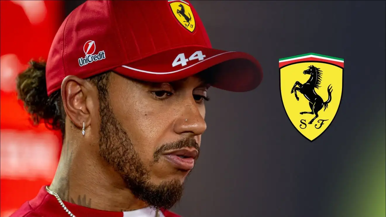 Lewis Hamilton speaks to media at the 2025 Emilia Romagna Grand Prix, with a Ferrari badge to his right
