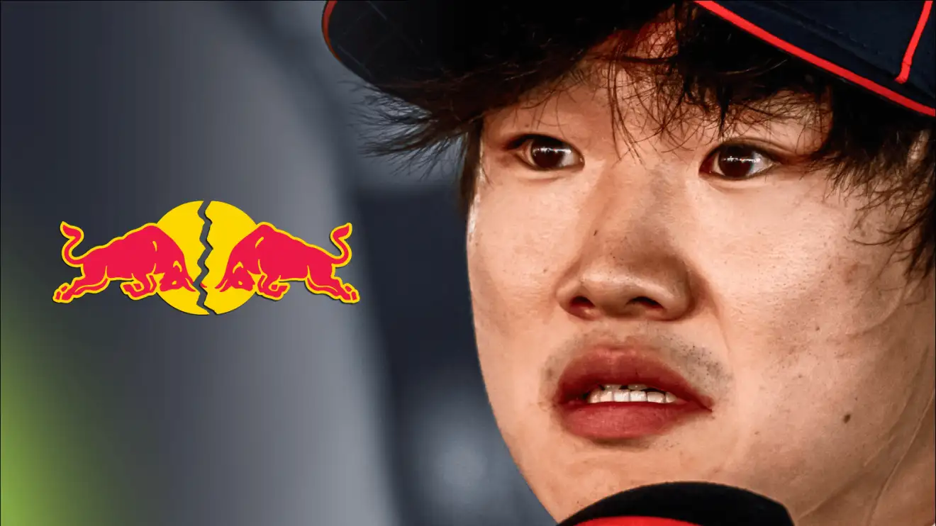 c-486 A close-up shot of a distressed Yuki Tsunoda with a cracked Red Bull logo alongside him