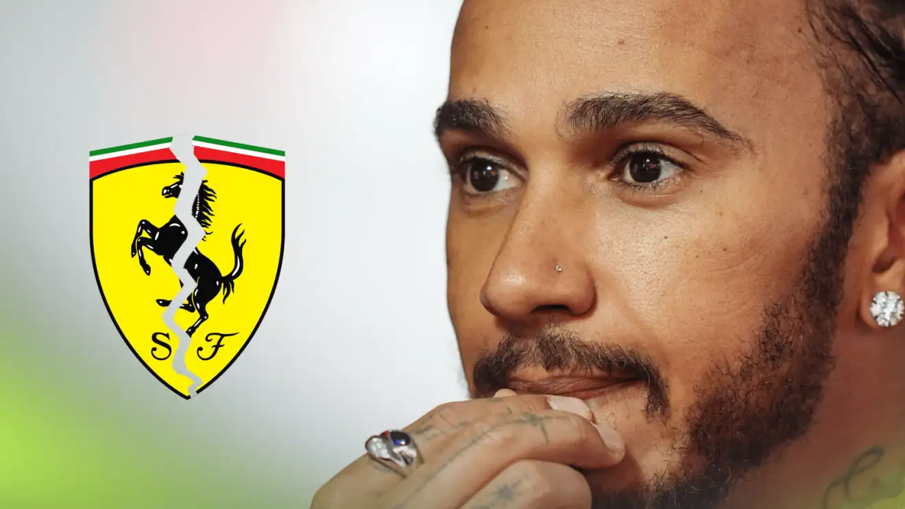 c-575 Lewis Hamilton holds his hand to his lips in concern with a cracked Ferrari badge alongside him