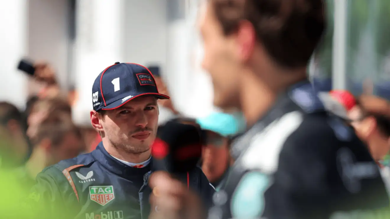 c-904 Max Verstappen looks on as George Russell speaks to the media in Canada