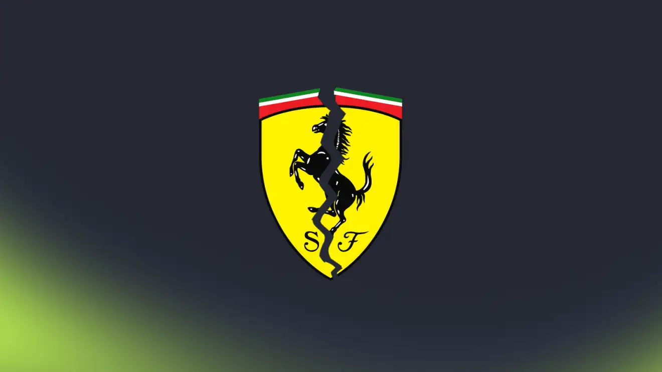 c-934 A Ferrari logo with a large crack running through the middle against a dark background