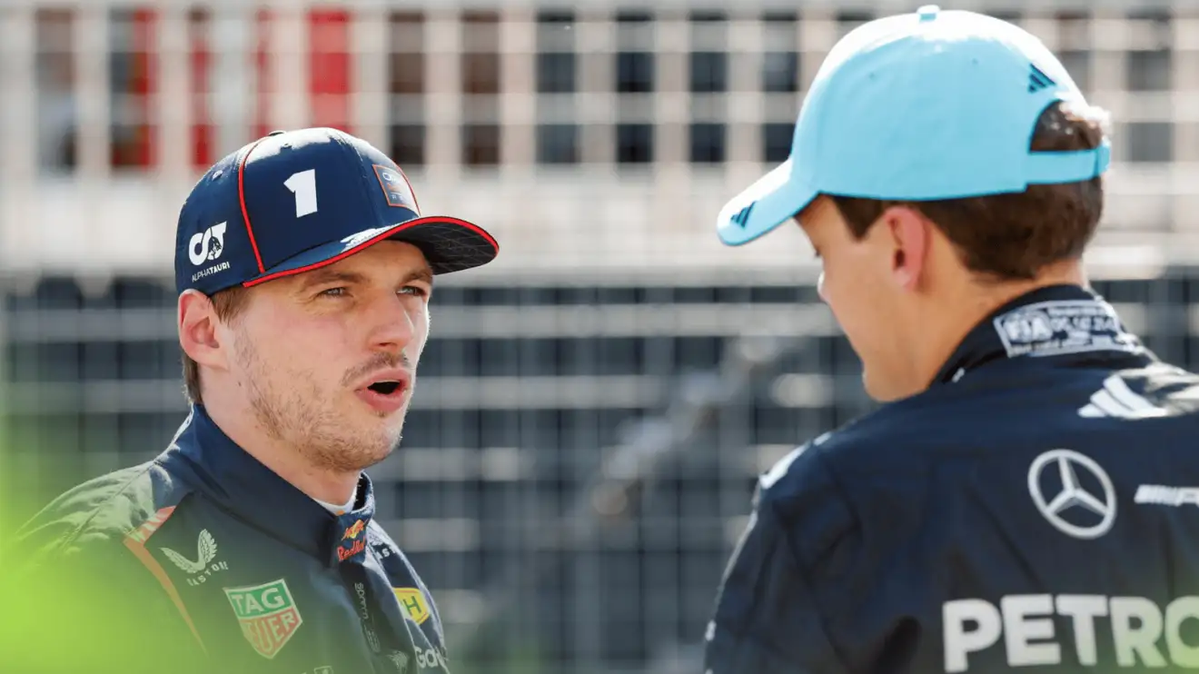 c-940 Max Verstappen and George Russell in conversation on the grid after qualifying in Canada