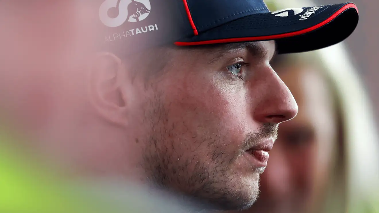c-958 A side-profile shot of Max Verstappen facing the media
