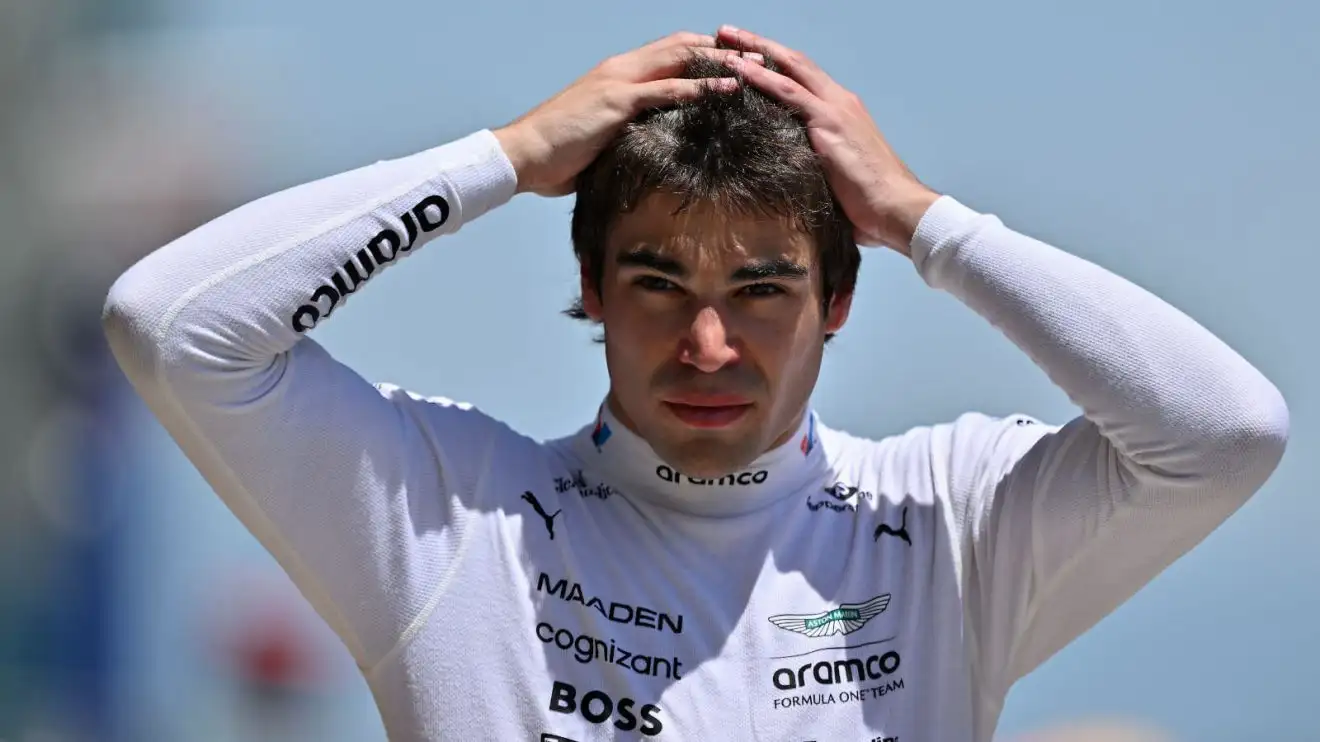 c-99 Lance Stroll with his hands on his head