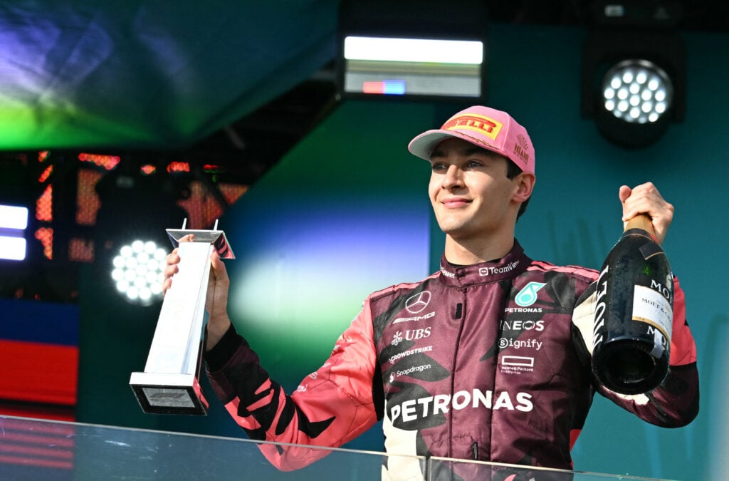 gettyimages-2212903837-1024x675-1 Mercedes driver George Russell celebrates on the podium at the 2025 F1 Miami Grand Prix