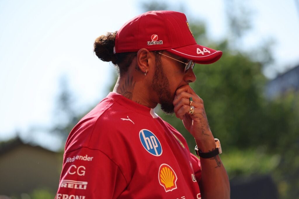 gettyimages-2214642052-1024x683-1 Ferrari driver Lewis Hamilton walks through the paddock before the 2025 F1 Emilia Romagna Grand Prix at Imola