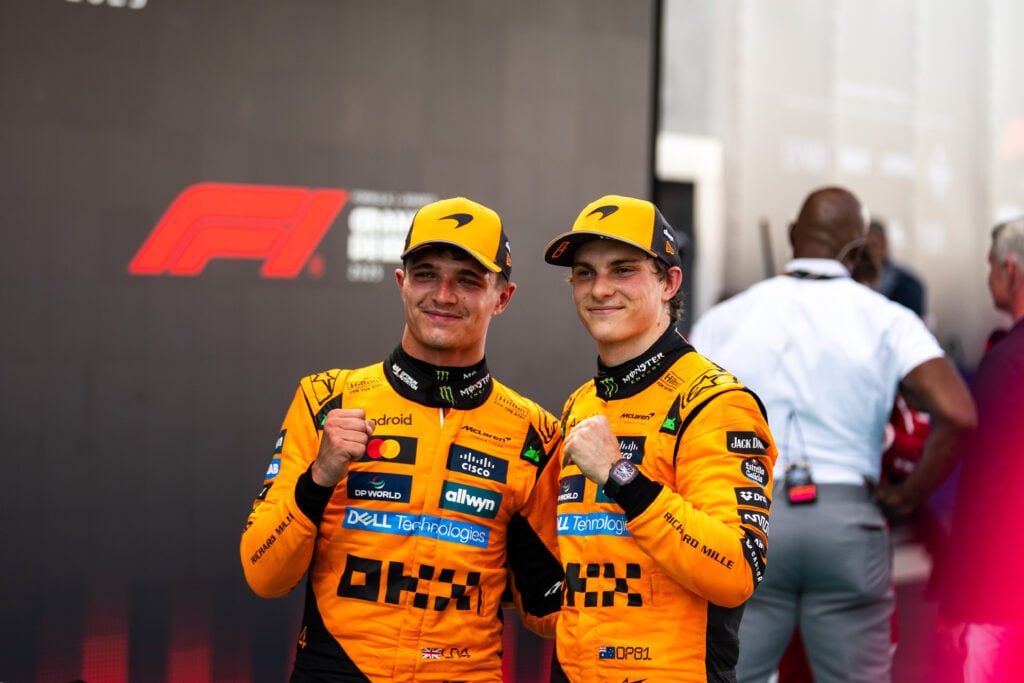 gettyimages-2217617835-1-1024x683-1 McLaren drivers Lando Norris and Oscar Piastri celebrating after the 2025 Spanish Grand Prix