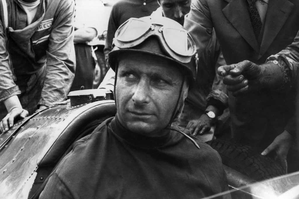 gettyimages-827612738-1024x682-1 Juan Manuel Fangio at the British Grand Prix in 1957 driving a Maserati 250F.