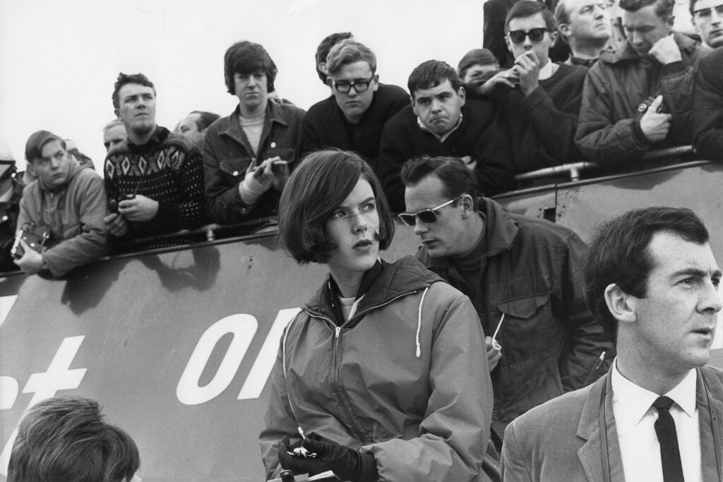 gettyimages-860109420-1024x683-1 Helen Stewart, wife of Jackie Stewart, at the 1965 British Grand Prix.